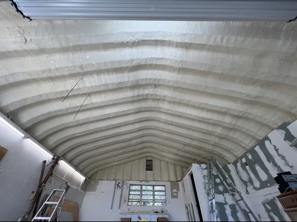 Spray polyurethane foam applied to the underside of a metal roof deck in Rockville Centre